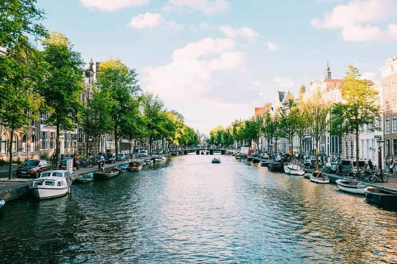 Amsterdam: Canal Cruise from Anne Frank Museum - A heated boat, photo deck, and practical comfort