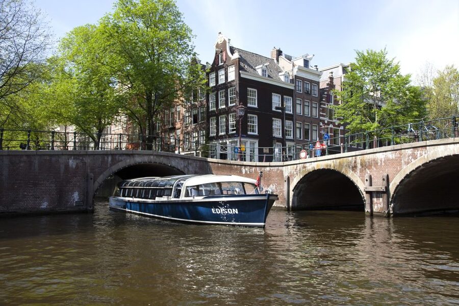Amsterdam: Van Gogh Museum Ticket and City Canal Cruise - Seeing Amsterdam from a covered canal boat