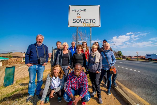Full-Day Soweto, Apartheid Museum and Lunch Tour - Walking through Motsoaledi informal settlement