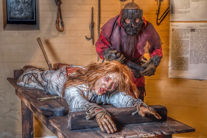 Medieval Torture Museum Ticket with Audio Guide and Ghost Hunting - Entering the dim exhibition rooms