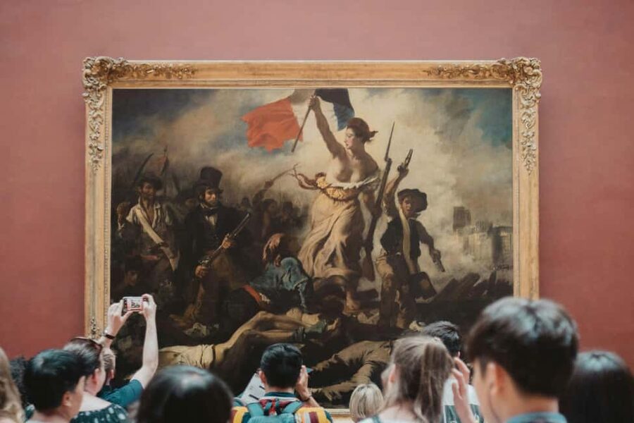 Paris: Louvre Museum Access with Host and Hop-On Hop-Off Bus - The Louvre in a focused two-hour visit